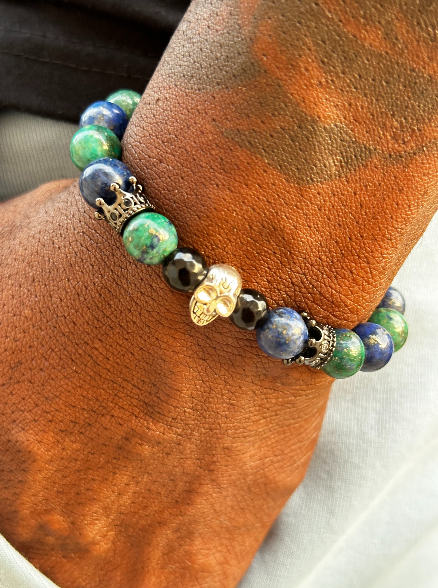 Lapis Lazuli Stone and Black Onyx Bracelet with Skull and Crown Charms